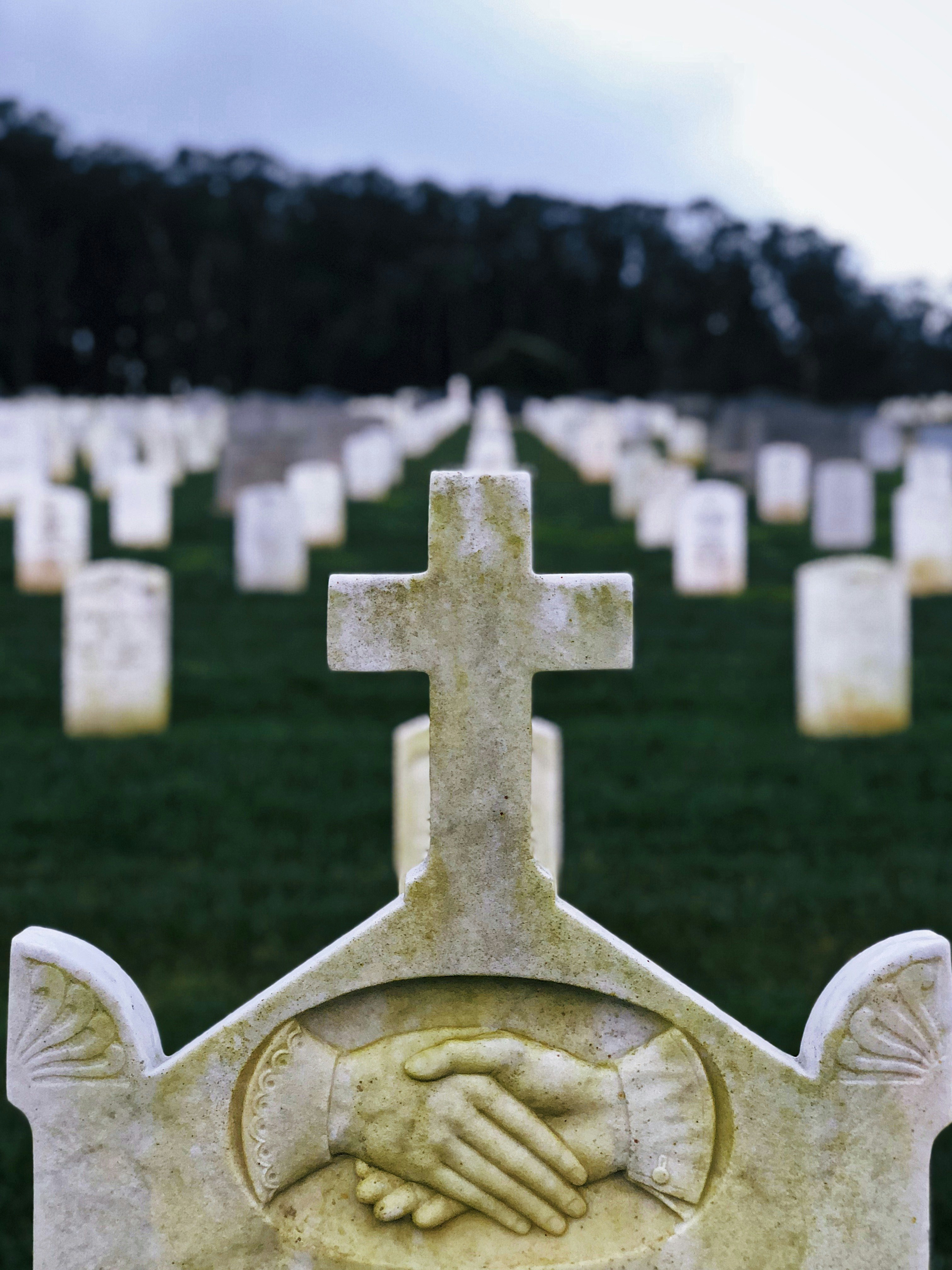 white tombstone selective focus photography